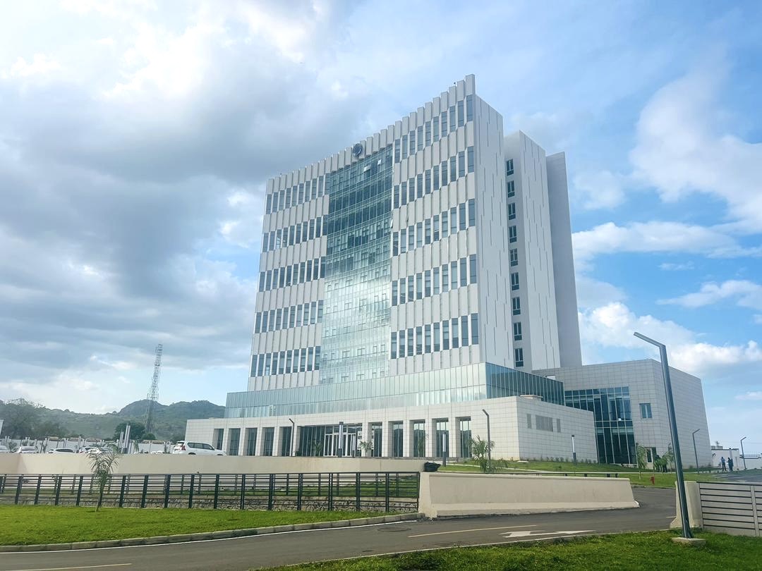 Modern government building with a citizen using a digital service kiosk